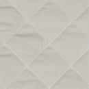 Pochette à langer Perlimpinpin, détail du tissu uni matelassé